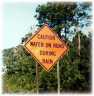 Caution - Water on Road During Rain